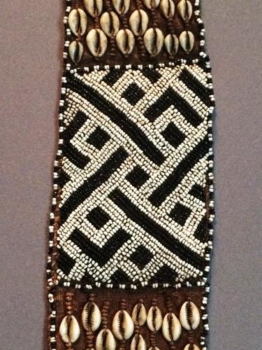 beaded belt with back and white beads and cowrie shells
