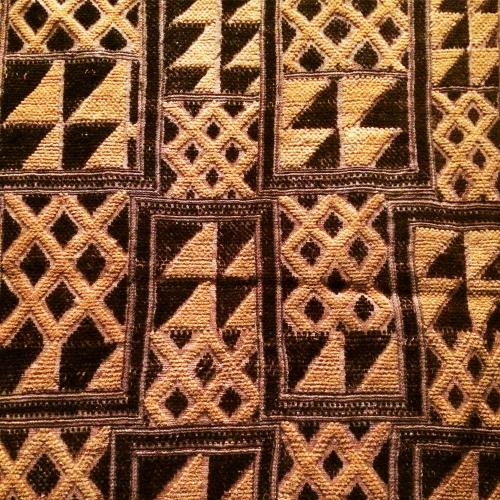panel made of contrasting dark and light fiber with geometric motifs