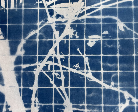 white vines moving across a grid of small blue squares