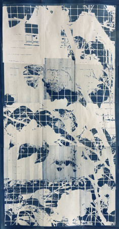 white vines and leaves across a grid of small blue squares