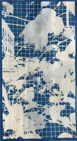 white vines and leaves across a grid of small blue squares