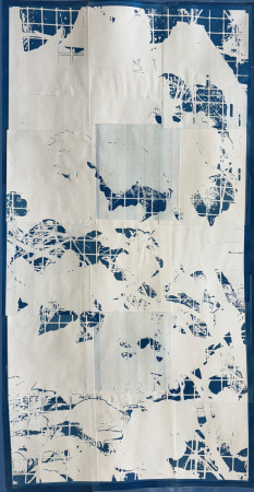 white vines and leaves across a grid of small blue squares